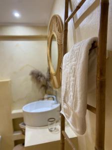 a bathroom with a sink and a mirror at Dream house Villa in Alyki