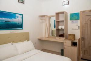 Postel nebo postele na pokoji v ubytování Rushkokaa Beach Villa