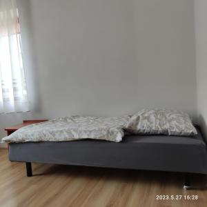 Łóżko lub łóżka w pokoju w obiekcie Apartament Pod Lipą