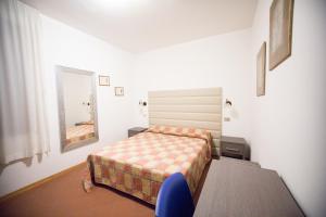 Posteľ alebo postele v izbe v ubytovaní Hotel I Tigli albergo diffuso + 12 fotografií