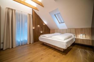 Postel nebo postele na pokoji v ubytování Holiday House U Hájenky 6L Lipno Home