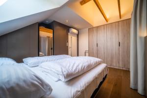 Postel nebo postele na pokoji v ubytování Holiday House U Hájenky 6L Lipno Home