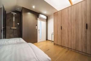 Postel nebo postele na pokoji v ubytování Holiday House U Hájenky 6L Lipno Home
