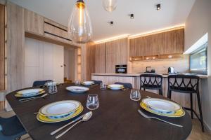 Kuchyň nebo kuchyňský kout v ubytování Holiday House U Hájenky 6L Lipno Home