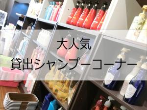 a refrigerator filled with lots of bottles of liquid at Hotel Port Moji in Kitakyushu