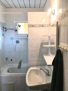 a bathroom with a sink and a bath tub at Apartmán Marta in Staré Splavy