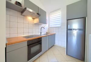 Kuchyň nebo kuchyňský kout v ubytování Apartments Adria Danka