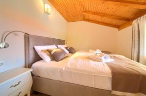 Postel nebo postele na pokoji v ubytování Apartments Adria Danka