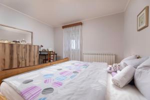 Postel nebo postele na pokoji v ubytování Apartment Krebelj by El-Pi Tours + 21 fotografií