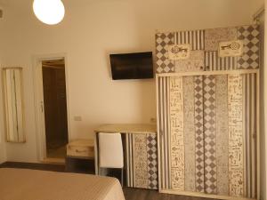 TV a/nebo společenská místnost v ubytování Hotel Villa Esedra