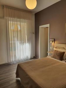 Postel nebo postele na pokoji v ubytování Hotel Villa Esedra