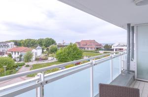 a balcony with a view of a street at Aparthotel Zingst in Zingst