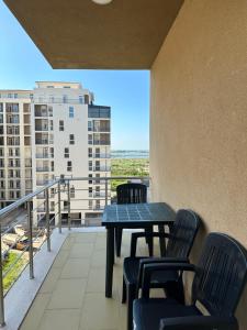 a balcony with a table and chairs and a view at Marjana's Apartment 4 in Lezhë