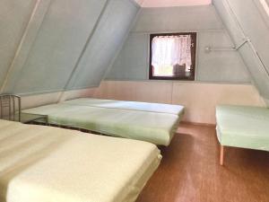 Postel nebo postele na pokoji v ubytování Chatová osada Zelený Háj