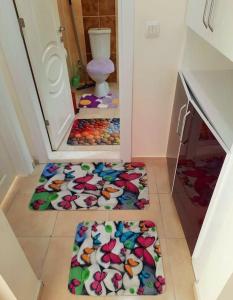 two mats on the floor in a room with a toilet at My Home in Beysehir