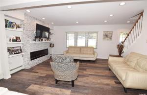 a living room with a couch and a fireplace at Romance Vacation Sweet Home 