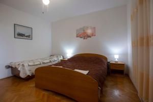 Säng eller sängar i ett rum på Apartments Davorka Šimuni