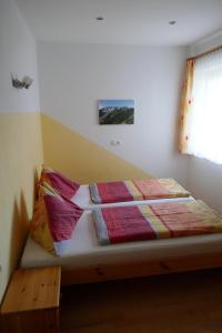 Łóżko lub łóżka w pokoju w obiekcie Apartment Neuhauser