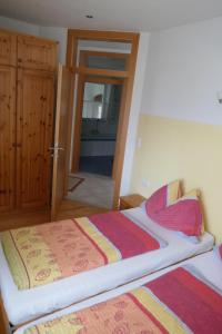 Łóżko lub łóżka w pokoju w obiekcie Apartment Neuhauser