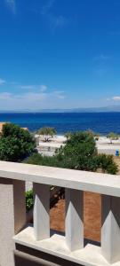 a view of the ocean from a balcony at Apartments Zvonimir,place by the sea in Mirce