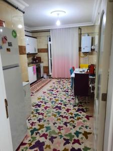 a room with a kitchen and a dining room at My Home in Beysehir