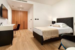 Krevet ili kreveti u jedinici u okviru objekta Amphora Hotel