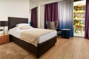 Krevet ili kreveti u jedinici u okviru objekta Amphora Hotel