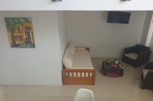 a model of a room with a couch and a table at Moderno y cómodo duplex en capital de San Juan in San Juan