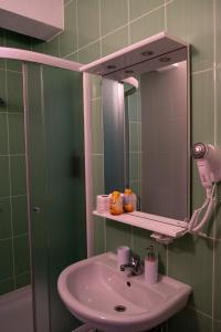 a bathroom with a sink and a mirror at Villa Mir in Mostar