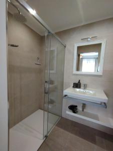 a bathroom with a shower and a sink at Villa Costera B&B in Sant Antoni de Calonge