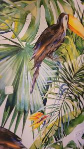 a painting of a bird in the jungle at Villa Blu in Sankt Kanzian