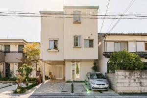 a car parked in front of a house at Sakai Kita-ku - House - Vacation STAY 10593 in Asakayamachō