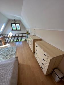 a room with boxes on the floor and a bed at Apartament in highlander style with view on Giewont & Tatra Mountain in Zakopane