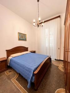 Postel nebo postele na pokoji v ubytování Savona Casa Vacanze vicino Mare 3 minuti WIFI