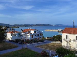 arial view of houses and a body of water at Evaggelia's Seaside Boutique Apartment in Ireon