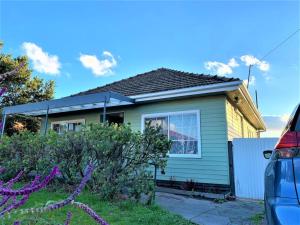 a house with a car parked in front of it at Easy Self Check-in accomodation in Springvale