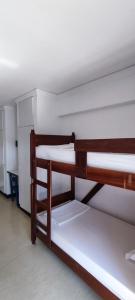 a group of bunk beds in a room at HI Ovar - Pousada de Juventude in Ovar