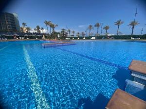 The swimming pool at or close to Playamar Primera linea front beach