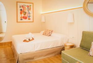 Tempat tidur dalam kamar di Casa Bassa Hotel