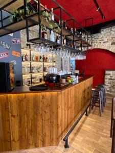 a bar with a wooden counter in a restaurant at Grey Stone in Gjirokastër