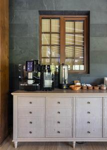 a kitchen with a counter with a coffee maker on it at Crona SPA Karpaty in Skhidnitsa