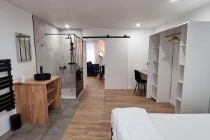 Postel nebo postele na pokoji v ubytování Le P'tit Indus , Duplex