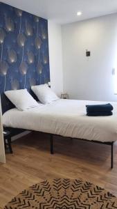 Postel nebo postele na pokoji v ubytování Le P'tit Indus , Duplex