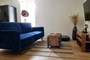 TV a/nebo společenská místnost v ubytování Le P'tit Indus , Duplex