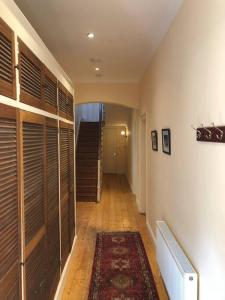 a hallway with wooden lockers and a staircase in a house at Family home in the heart of Dublin in Dublin