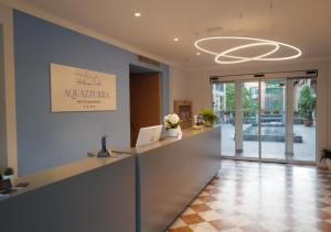an office with a reception desk in a building at Aquazzurra Resort & Aparthotel in Cannobio