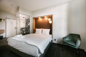 Postel nebo postele na pokoji v ubytování Travel24 Hotel Leipzig City
