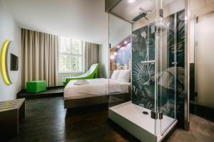 Postel nebo postele na pokoji v ubytování Travel24 Hotel Leipzig City