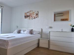 Postel nebo postele na pokoji v ubytování Guesthouse Dominović