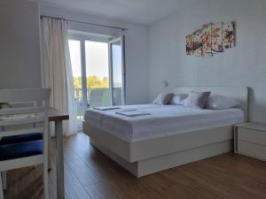 Postel nebo postele na pokoji v ubytování Guesthouse Dominović